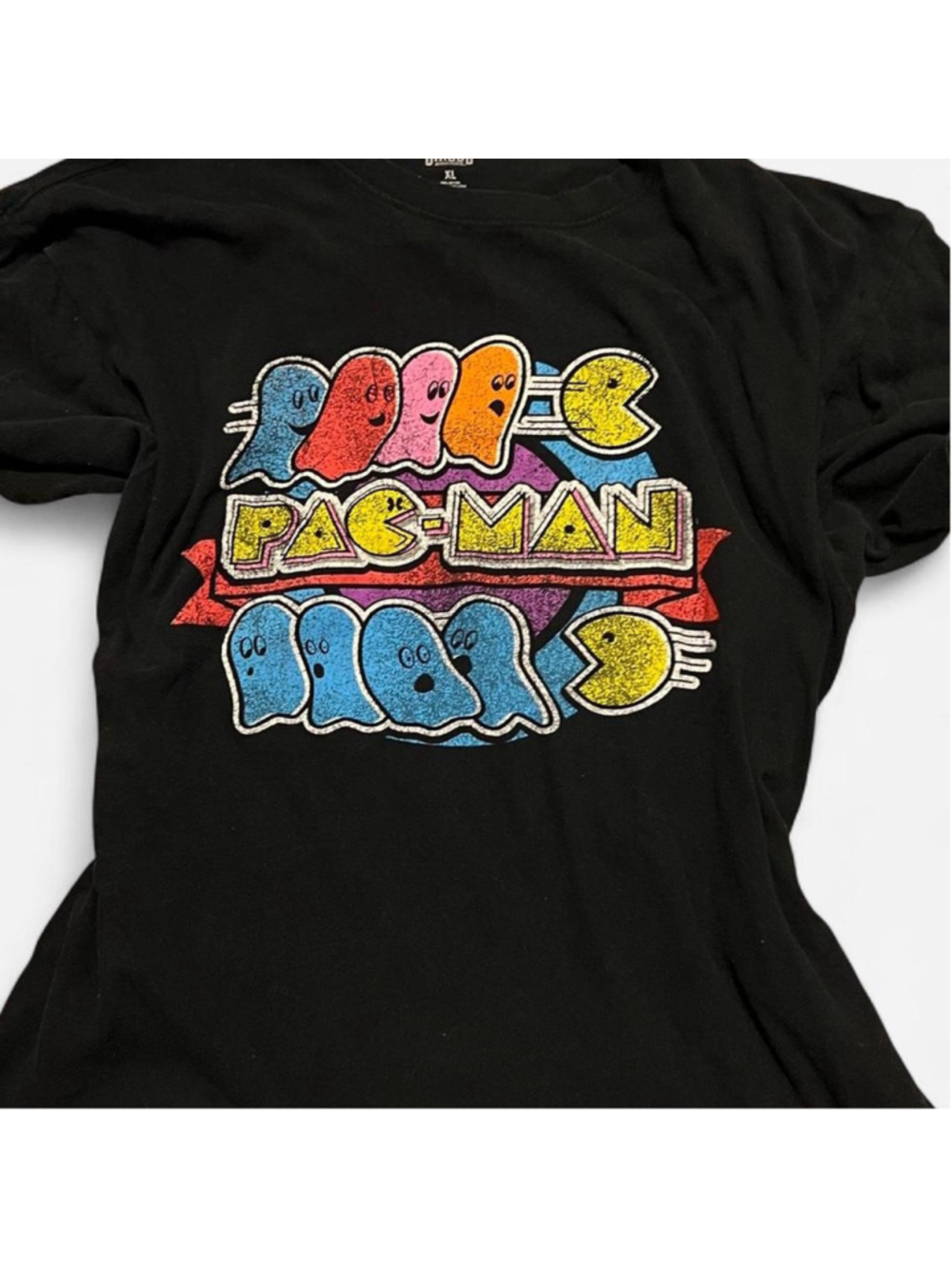 Retro Pac-Man graphic tee featuring colorful ghosts and distressed arcade-style